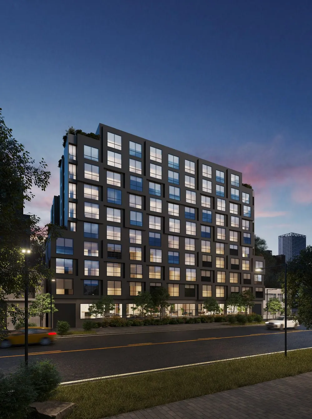 Render nocturno del edificio Quadro Smartliving en Bogotá